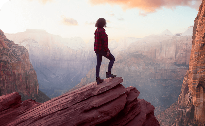 Woman conquering Rock climb in the great outdoors